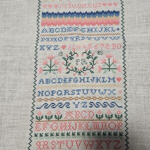 Vintage Cross-Stitch Tapestry Sampler with Alphabet & Floral Design
